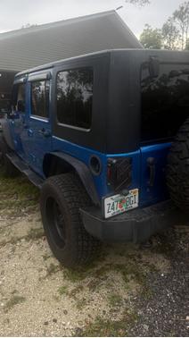 Blue 2015 Jeep Wrangler Unlimited Sport