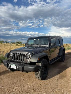Black 2016 Jeep Wrangler Unlimited Sport