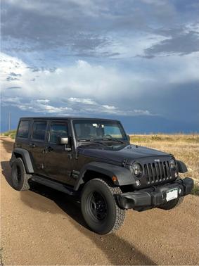Black 2016 Jeep Wrangler Unlimited Sport