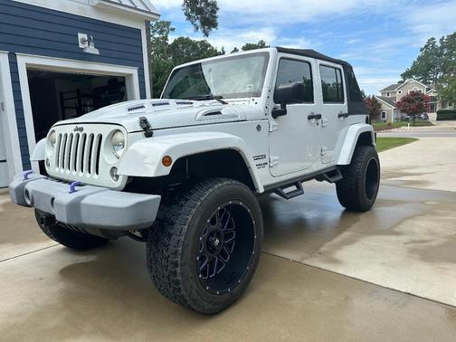 White 2014 Jeep Wrangler Unlimited Sport
