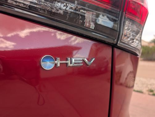 Red 2026 Toyota Highlander Hybrid Limited