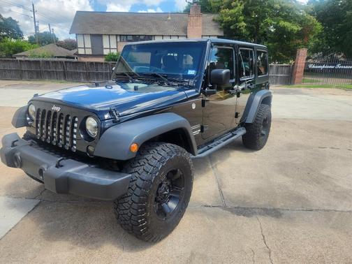 Black 2016 Jeep Wrangler Unlimited Sport