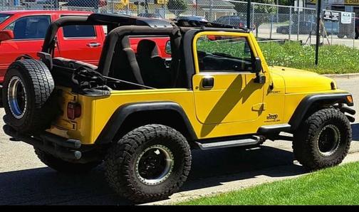 Yellow 2004 Jeep Wrangler Sport