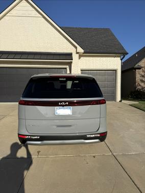 Silver 2024 Kia Carnival EX