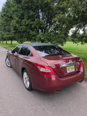 Red 2010 Nissan Maxima S