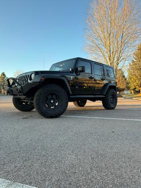 Black 2013 Jeep Wrangler Unlimited Sport