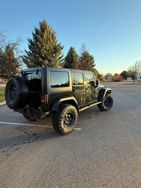 Black 2013 Jeep Wrangler Unlimited Sport