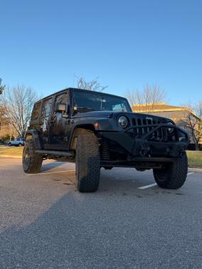 Black 2013 Jeep Wrangler Unlimited Sport