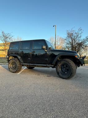 Black 2013 Jeep Wrangler Unlimited Sport