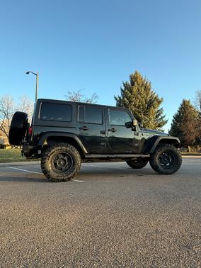 Black 2013 Jeep Wrangler Unlimited Sport