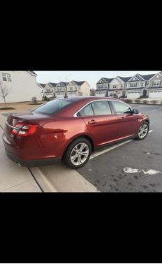 Red 2014 Ford Taurus SEL