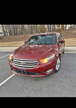 Red 2014 Ford Taurus SEL