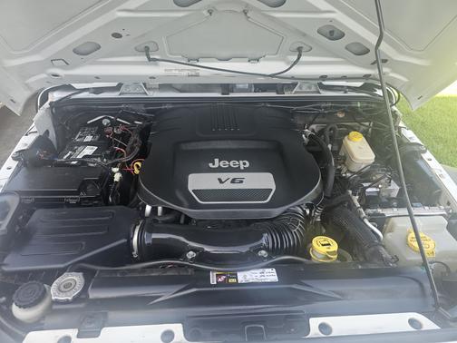 White 2015 Jeep Wrangler Unlimited Sport