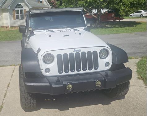 White 2015 Jeep Wrangler Unlimited Sport