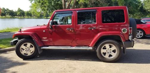 Red 2011 Jeep Wrangler Unlimited Sahara