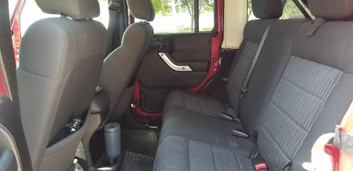 Red 2011 Jeep Wrangler Unlimited Sahara