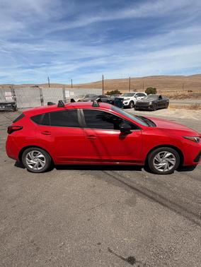 Red 2024 Subaru Impreza Base