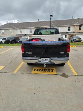 Black 1999 Ford F-350 Lariat SuperCab Super Duty