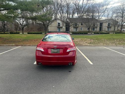 Red 2010 Toyota Camry LE