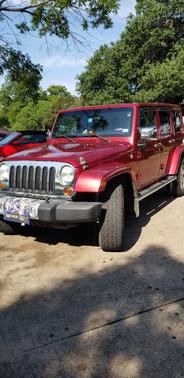 Purple 2011 Jeep Wrangler Unlimited Sahara
