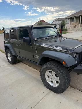 Green 2015 Jeep Wrangler Unlimited Sport