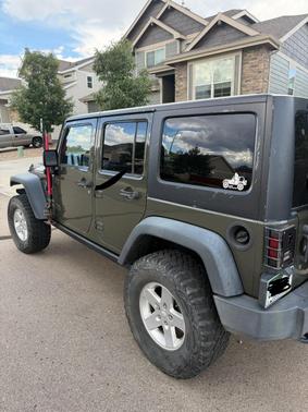 Green 2015 Jeep Wrangler Unlimited Sport