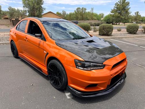 Orange 2014 Mitsubishi Lancer Evolution GSR