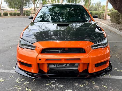 Orange 2014 Mitsubishi Lancer Evolution GSR