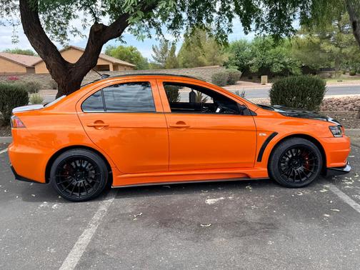 Orange 2014 Mitsubishi Lancer Evolution GSR