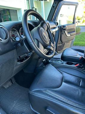 Blue 2015 Jeep Wrangler Unlimited Sahara