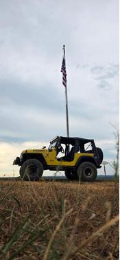 Yellow 1999 Jeep Wrangler Sport