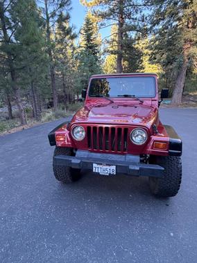Red 1999 Jeep Wrangler Sport