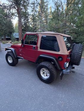 Red 1999 Jeep Wrangler Sport