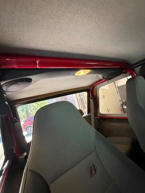 Red 1999 Jeep Wrangler Sport