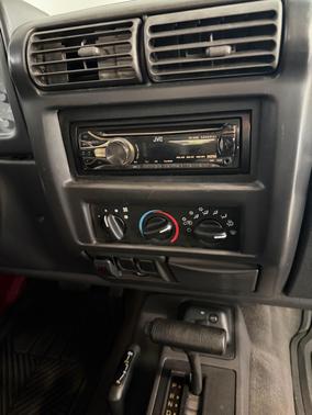 Red 1999 Jeep Wrangler Sport