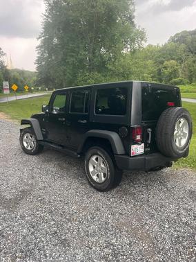 Black 2014 Jeep Wrangler Unlimited Sport