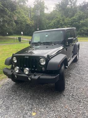 Black 2014 Jeep Wrangler Unlimited Sport
