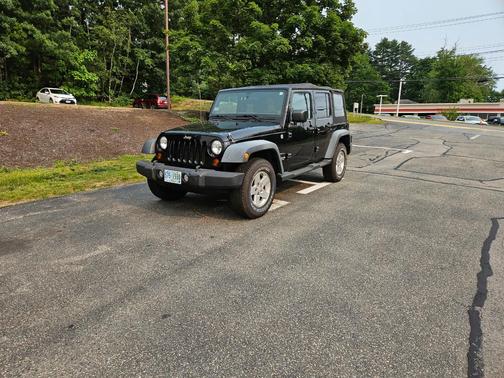 Black 2011 Jeep Wrangler Unlimited Sport