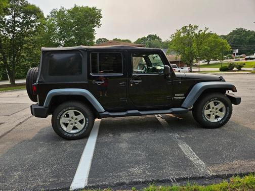 Black 2011 Jeep Wrangler Unlimited Sport