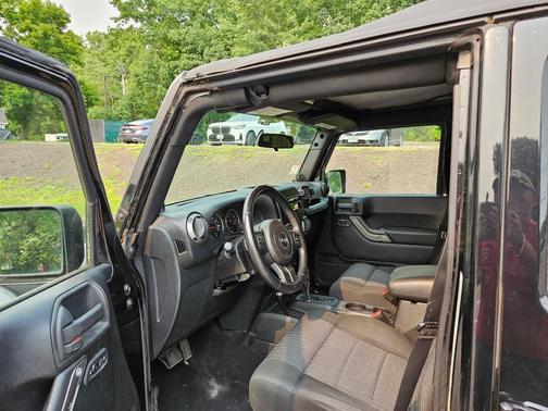 Black 2011 Jeep Wrangler Unlimited Sport