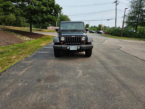Black 2011 Jeep Wrangler Unlimited Sport