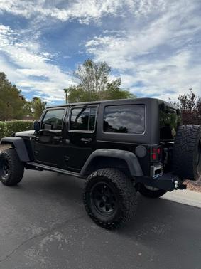 Black 2016 Jeep Wrangler Unlimited Sport