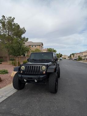 Black 2016 Jeep Wrangler Unlimited Sport
