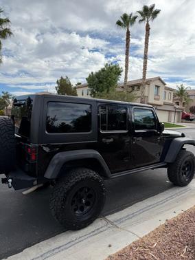 Black 2016 Jeep Wrangler Unlimited Sport
