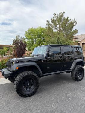 Black 2016 Jeep Wrangler Unlimited Sport
