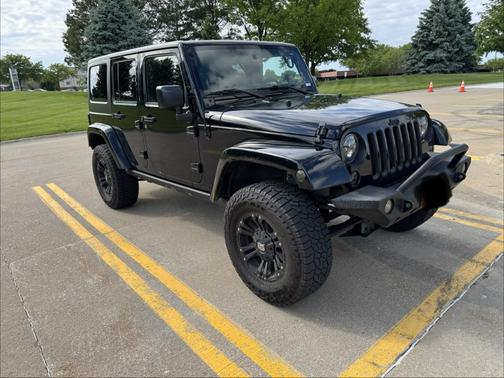 Black 2016 Jeep Wrangler Unlimited Sahara