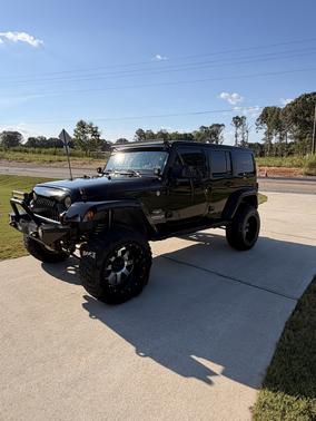 Black 2011 Jeep Wrangler Unlimited Sahara