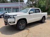 Photo of 2025 Glacier White Nissan Frontier