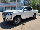Photo of 2025 Glacier White Nissan Frontier