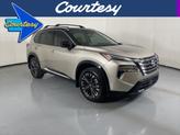 Photo of 2025 Champagne Silver Metallic/Super Black Nissan Rogue